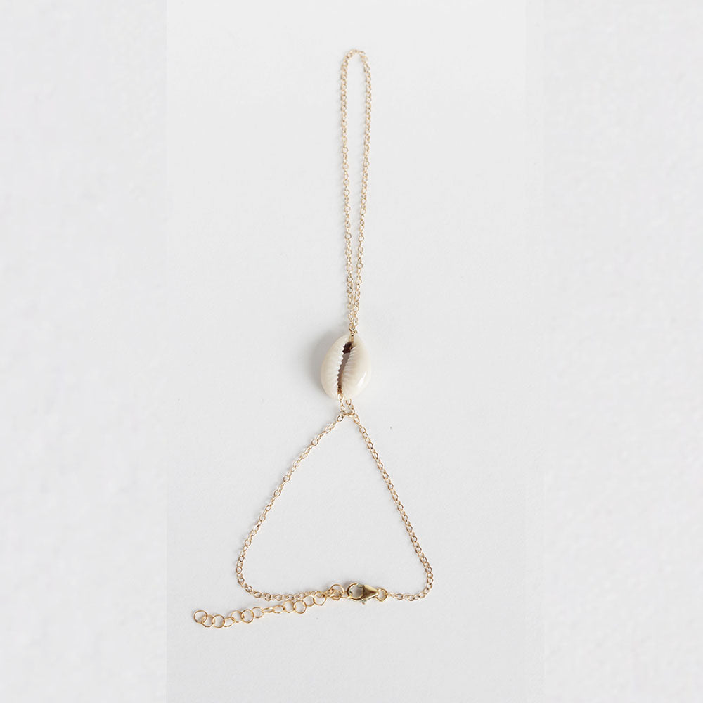The shell handchain is made of gold filled chain and a cowrie shell.  Adjustable so one size fits all.