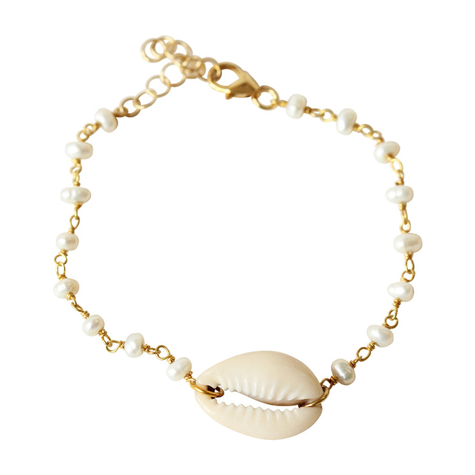 This dainty shell stacking bracelet is made from gold filled chain, pearls, and a cowrie shell.  Adjustable with an extension.  Chains by Lauren
