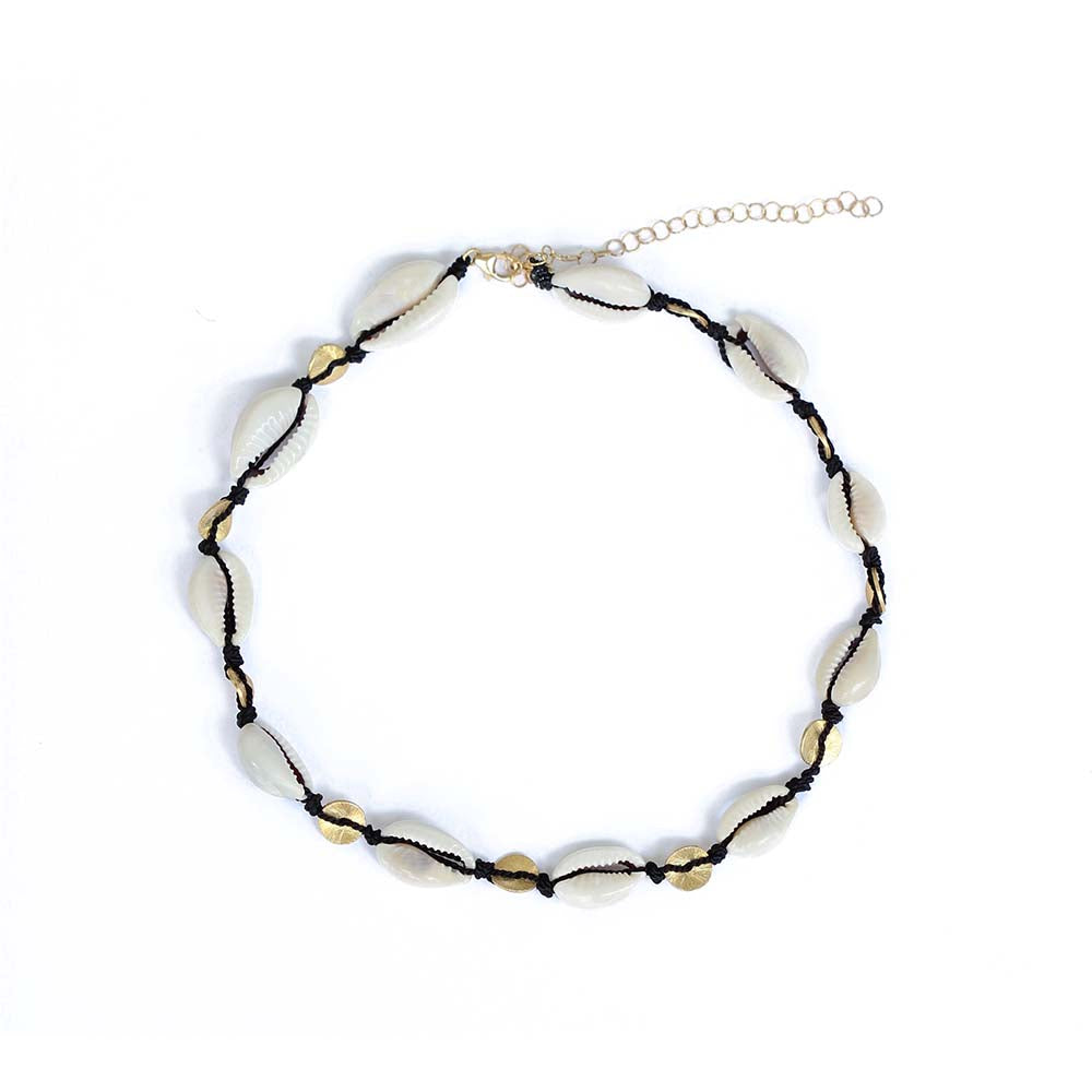 Wear the cowrie necklace as a choker or a double wrap bracelet.  Chains by Lauren