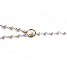 Close up of fresh water pearl lariat. Made of fresh water pearls, gold plated silver chain and a gold fill toggle. Handmade. Chains by Lauren