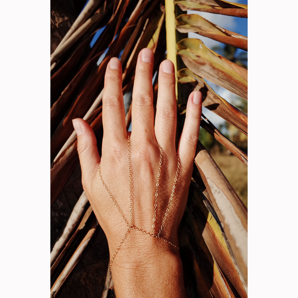 Delicate gold handchain available in gold fill and sterling silver. Super simple and easy to wear on the daily. Chains by Lauren