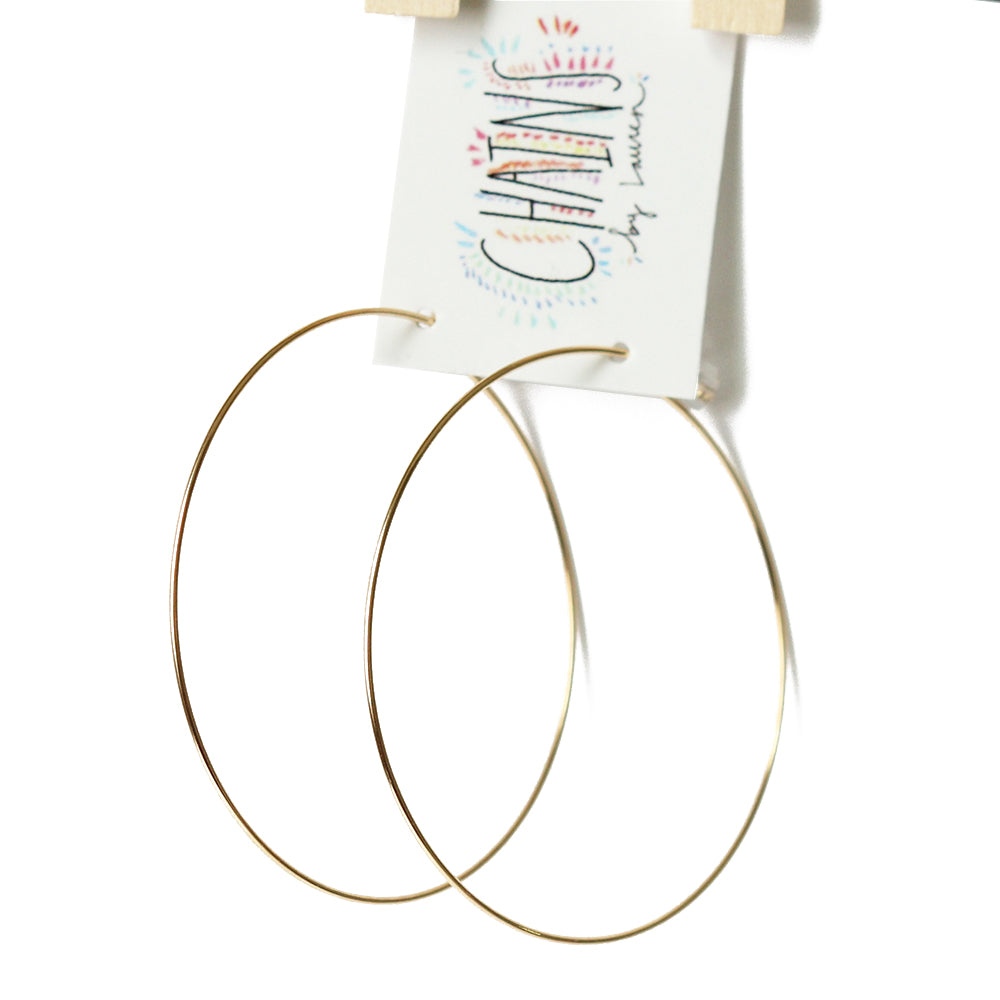 Super lightweight gold hoops with backings.  Made from gold fill.  Great for sensitive skin.  Handmade.  Chains by Lauren