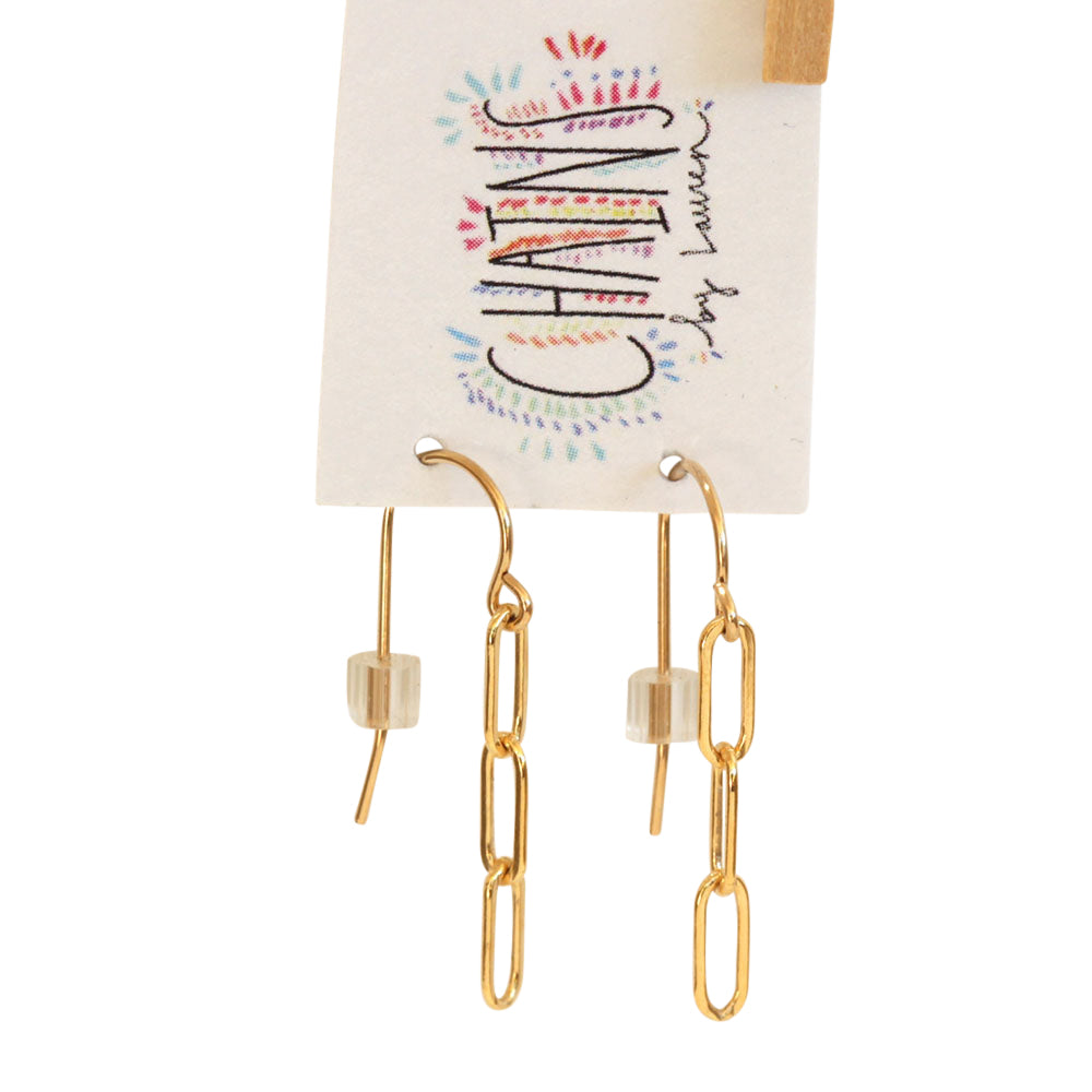 Tiny gold paper clip earrings. Available in sterling silver as well. Chains by Lauren