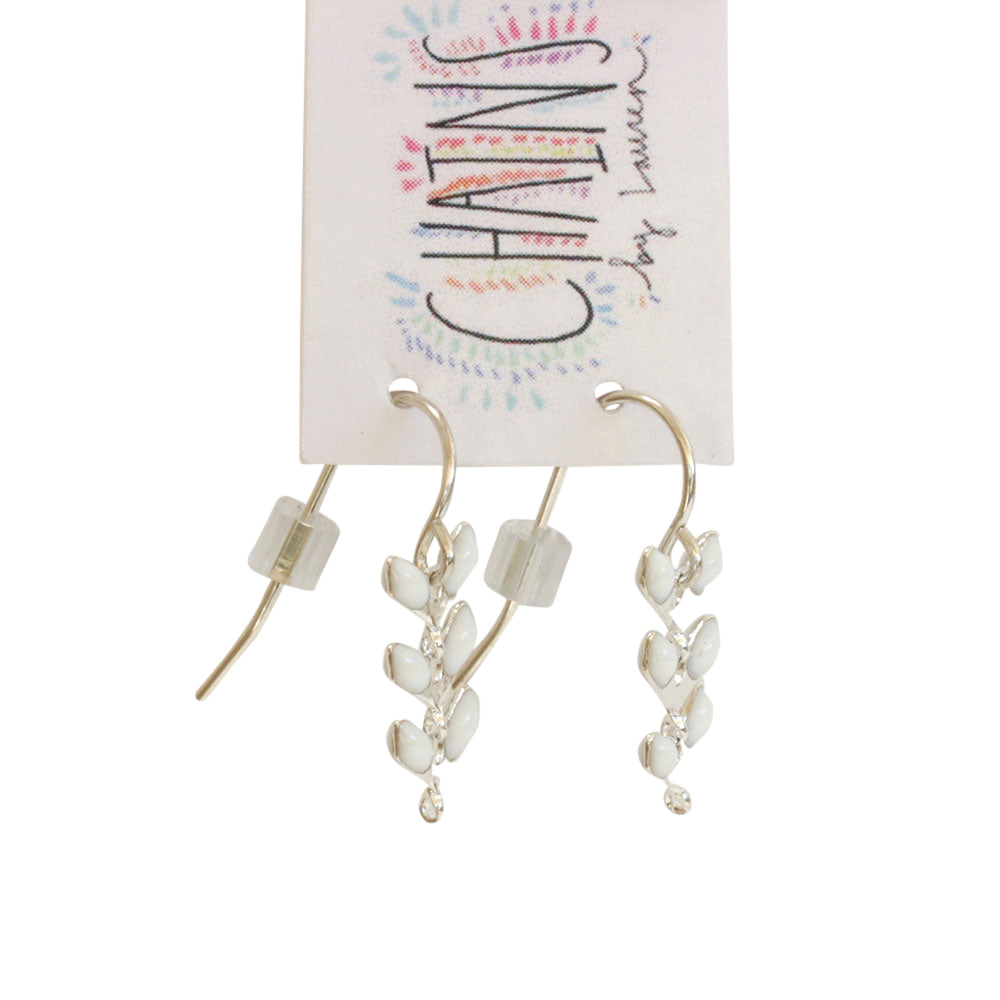 These tiny silver earrings are handmade. Available in gold as well. Chains by Lauren