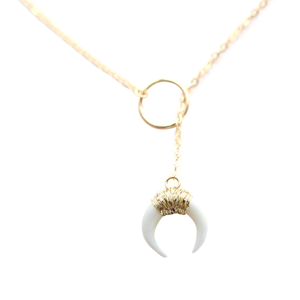 Close up of the white horn lariat.  Made of gold fill and bone.  Also, available in black.  Handmade.  Chains by Lauren
