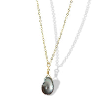 Dive into the world of sophistication with our Black Iridescent Pearl Gold Necklace on 14k gold filled chain