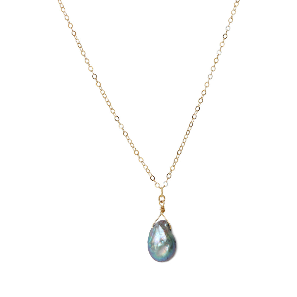 Embrace the timeless beauty of pearls and the shine of 14k gold filled chain, elevating your jewelry collection with our Black Iridescent Pearl Necklace.