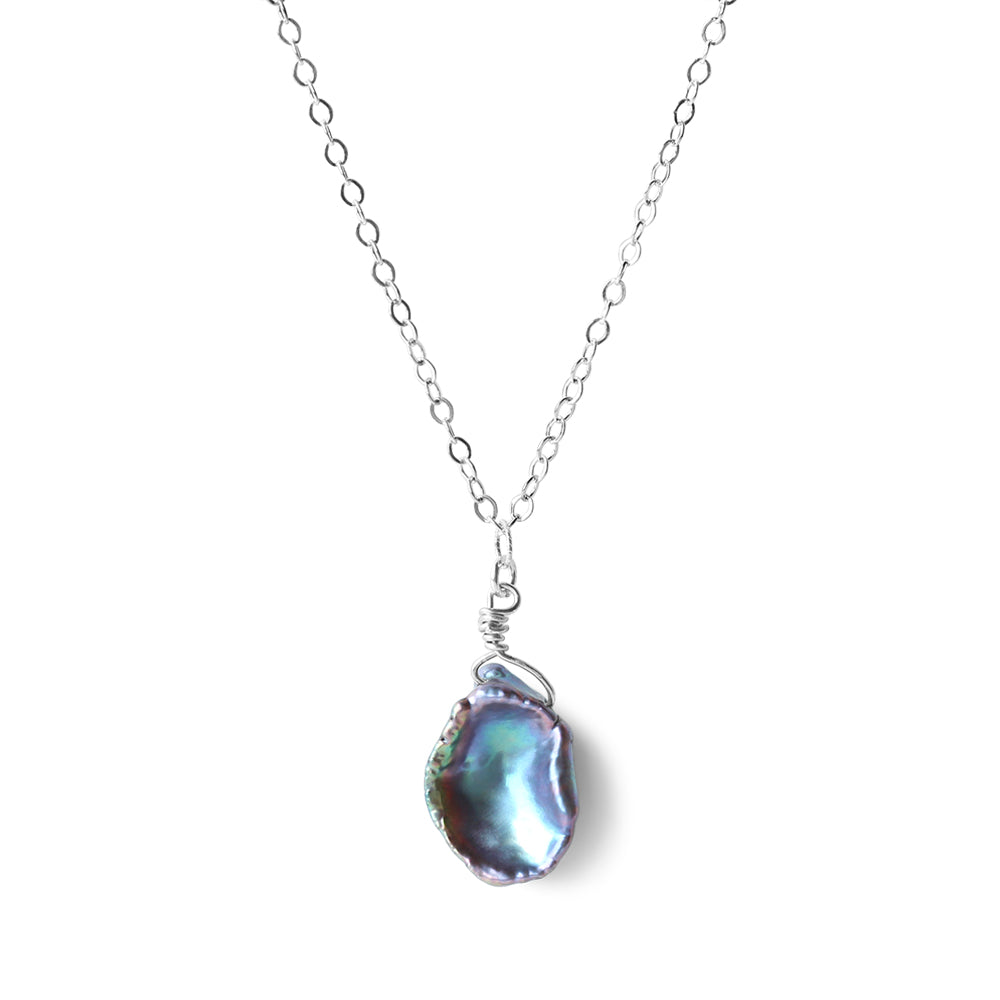 Crafted with precision and care, this necklace features alluring black iridescent pearls, exquisitely attached to a sterling silver chain. 