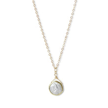 Each necklace features a genuine freshwater coin pearl, showcasing its unique luster and iridescent charm. 