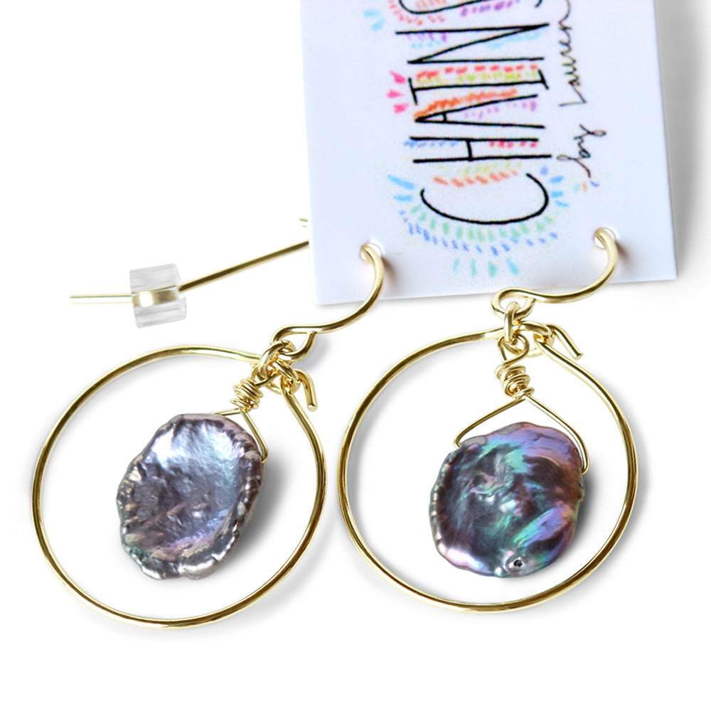 The iridescent pearls are the epitome of elegance, exhibiting a mesmerizing play of colors that catch the light from every angle. 