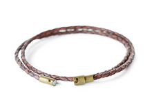 This unisex dark brown leather wrap bracelet comes in a range of color and sizes.