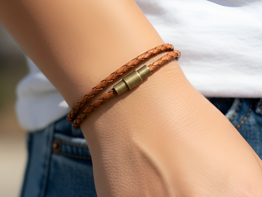 Women's caramel brown wrap leather bracelet.  Easy to put on yourself since the closure is magnetic.  The safety lock ensures it'll stay on your wrist.