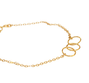 This dainty gold stacking bracelet is made from gold filled chain.  The dainty and delicate 3 ring gold charm bracelet.   Chains by Lauren