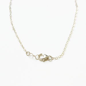 Sterling silver charm necklace.  Adjustable at the back neck with a lobster claw and extension.  Chains by Lauren