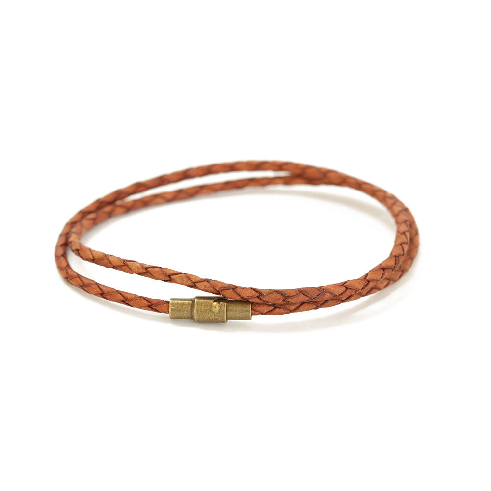 Women's caramel brown wrap leather bracelet.  Easy to put on yourself since the closure is magnetic.  The safety lock ensures it'll stay on your wrist.  Available in XS for tiny wrists and XL for men.  Also available in a range of sizes.  Handmade in the US!  Chains by Lauren