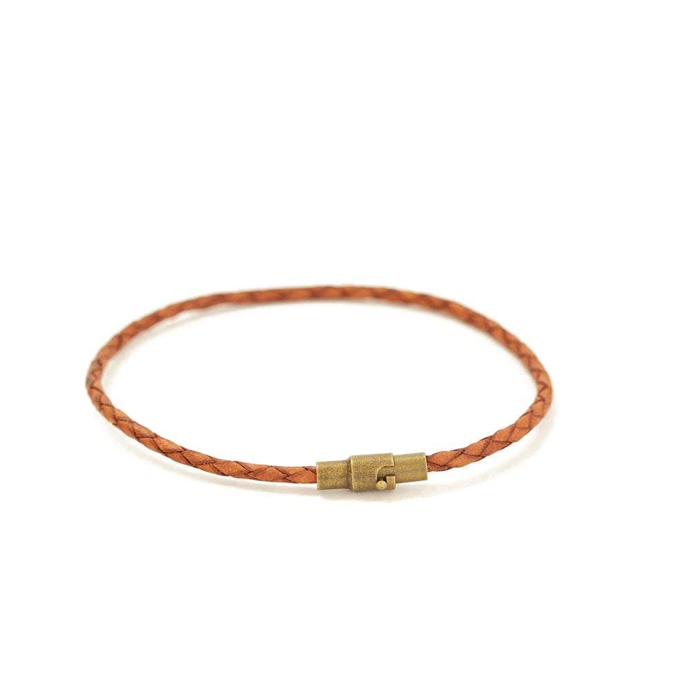 Women's caramel brown thin leather bracelet with a magnetic closure.  Easy to put on yourself since the closure is magnetic.  The safety lock ensures it'll stay on the wrist.  Chains by Lauren