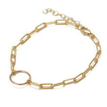 The dainty paper clip chain stacking bracelet is made of gold filled chain and charm.  The color will stay.  Chains by Lauren