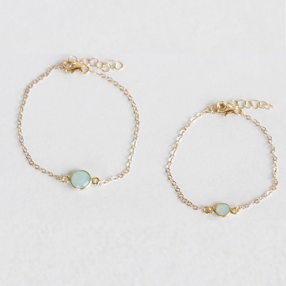 Mother and daughter chalcedony bracelet set. The mother wears the larger stone and the daughter wears the smaller stone. Perfect for mother and daughter jewelry. Found on chainsbylauren.us. Handmade. Chains by Lauren