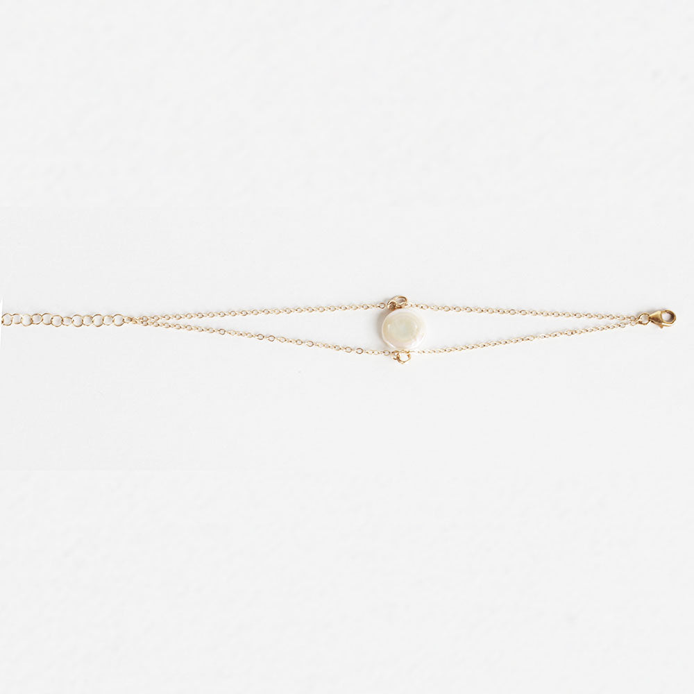 Pearl charm bracelet.  Made with a fresh water pearl and gold fill chain.  Chains by Lauren.