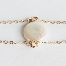 Close up of the pearl charm bracelet.  Made with a fresh water pearl and gold fill chain.  Chains by Lauren.