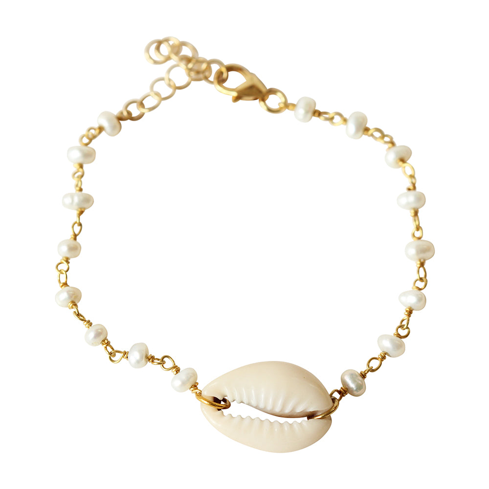 This dainty shell stacking bracelet is made from gold filled chain, pearls, and a cowrie shell.  Adjustable with an extension.  Chains by Lauren