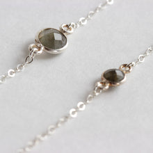 Close up of the labradorite stone for the matching mother and daughter labradorite bracelet set.   Made from labradorite stones and sterling silver chain. The mother wears the larger stone and the daughter wears the baby labradorite stone. Choose from a range of sizes for a 1 to 10 year old. Handmade with love. Chains by Lauren