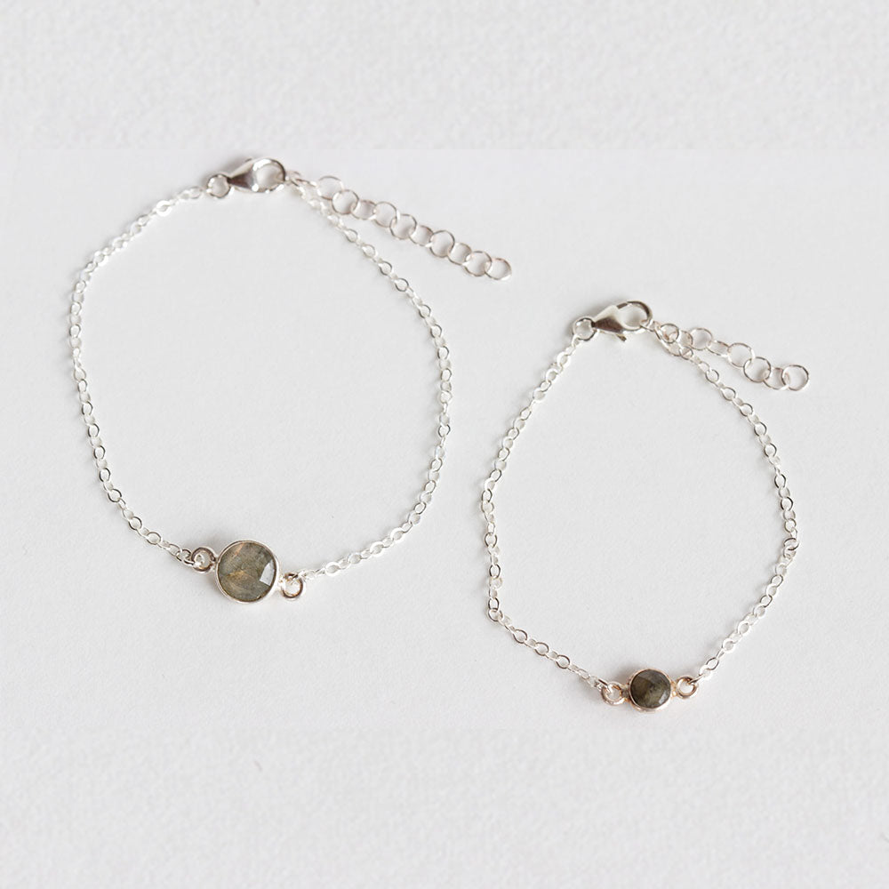 Matching mother and daughter labradorite bracelet set made from labradorite stones and sterling silver chain. The mother wears the larger stone and the daughter wears the baby labradorite stone. Choose from a range of sizes for a 1 to 10 year old. Handmade with love. Chains by Lauren