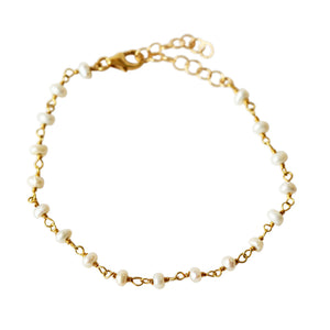 The dainty pearl bracelet is made of baby pearls and gold plated silver wire.  Super dainty and easy to stack! 