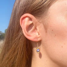 Tiny evil eye earrings with gold filled ear wires.  Chains by Lauren