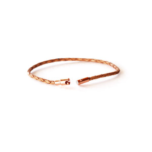 Women's thin leather bracelet made with leather and a rose gold magnetic closure.