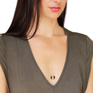 Black horn lariat.  Made from gold fill chain and the black charm is carved out of bone.  Chains by Lauren