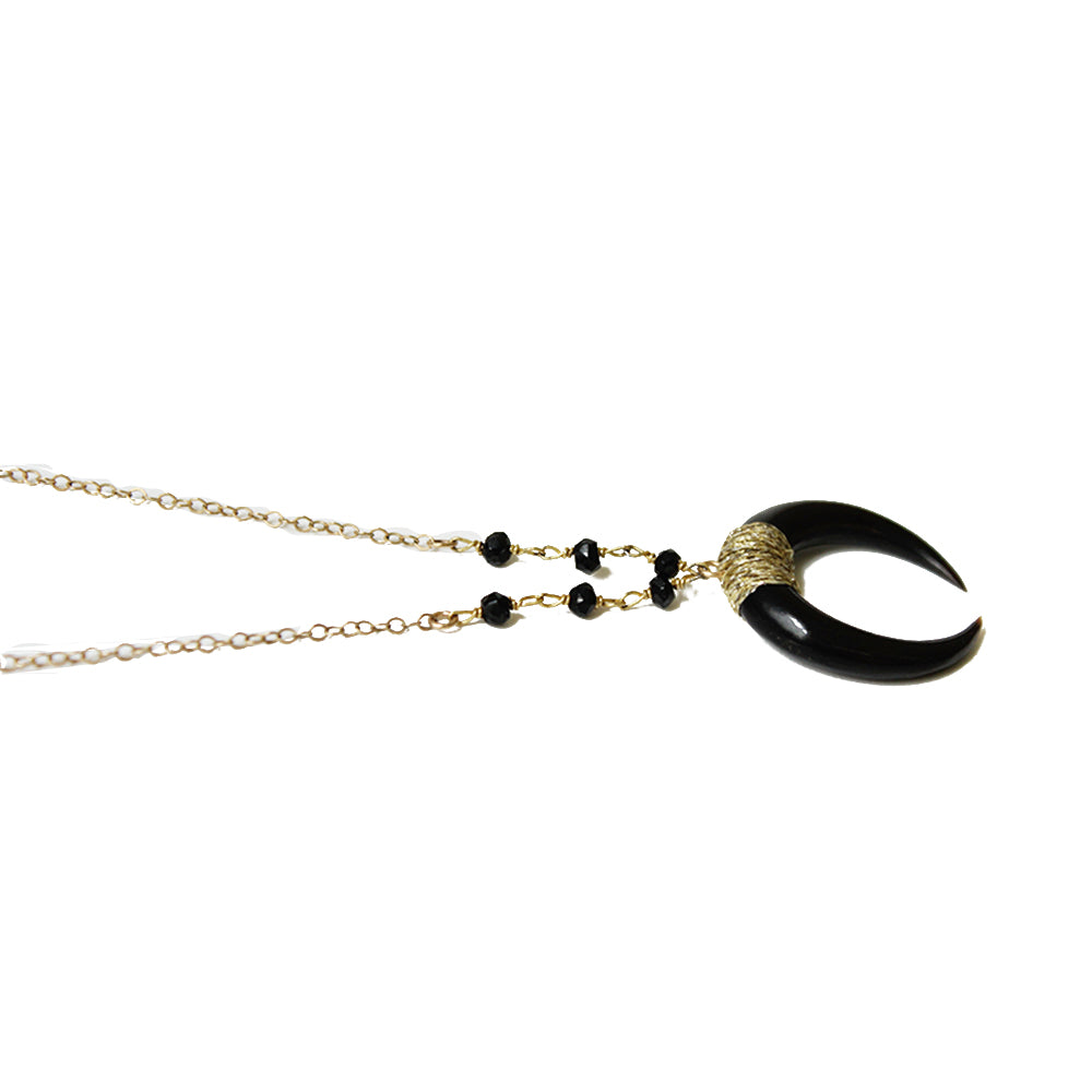 Close up of the black horn necklace in a range of lengths from 18"-24". Made with black spinel beads, and gold fill chain. Adjustable at the back neck. Handmade. Chains by Lauren