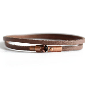 This men's brown leather wrap bracelet secures with a magnetic closure and safety lock.  Available in sizes XS-XL.   Chains by Lauren