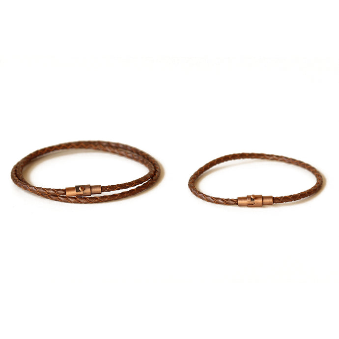 Brown leather couple bracelets.  Secures with a magnetic closure and a safety lock.  Chains by Lauren