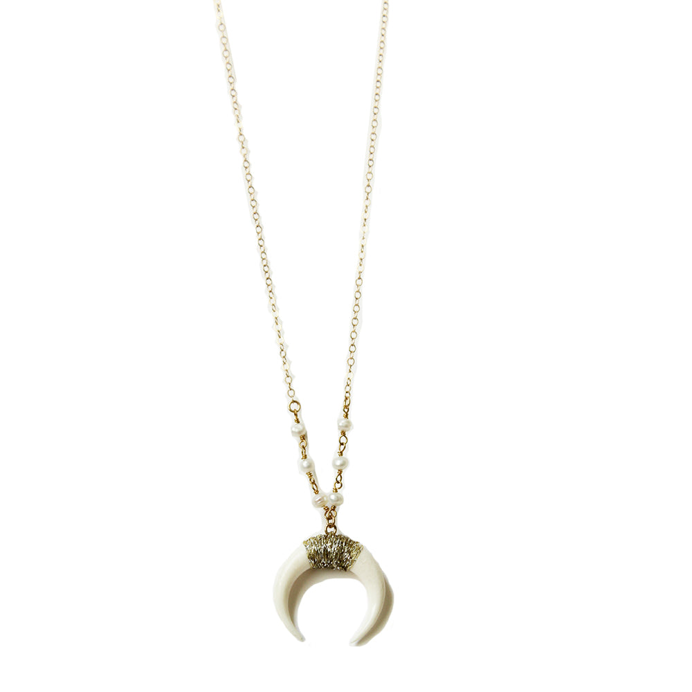 White horn necklace in a range of lengths from 18"-24". Made with pearls, and gold fill chain. Adjustable at the back neck. Handmade. Chains by Lauren