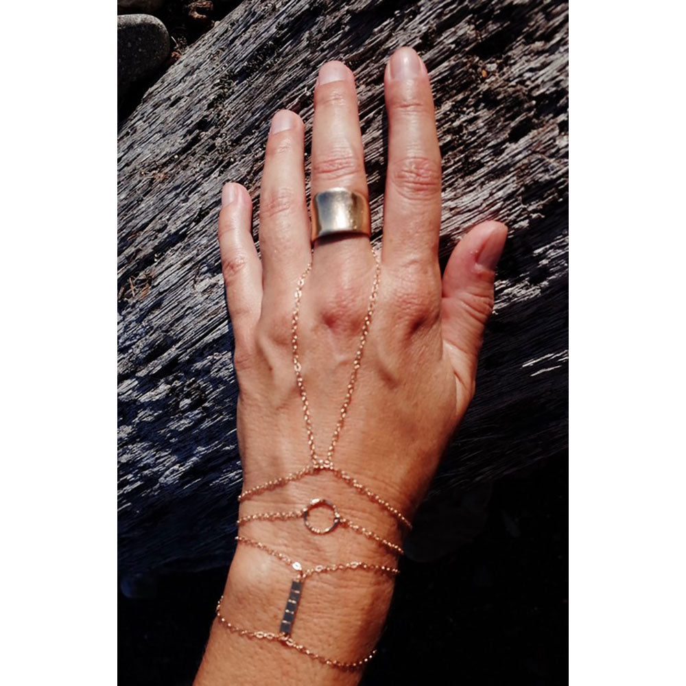 Dainty gold stacking bracelet is made from gold filled chain.  Wear this in the water and the color will remain the same!  Worn here with the hand chain bracelet and gold charm layering bracelet.  Shop all at chainsbylauren.us.  Chains by Lauren