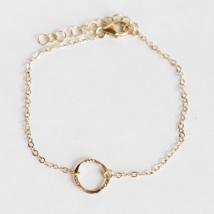 This dainty gold stacking bracelet is perfect to wear daily.  Simple and elegant. Adjustable so one size fits all.   Chains by Lauren