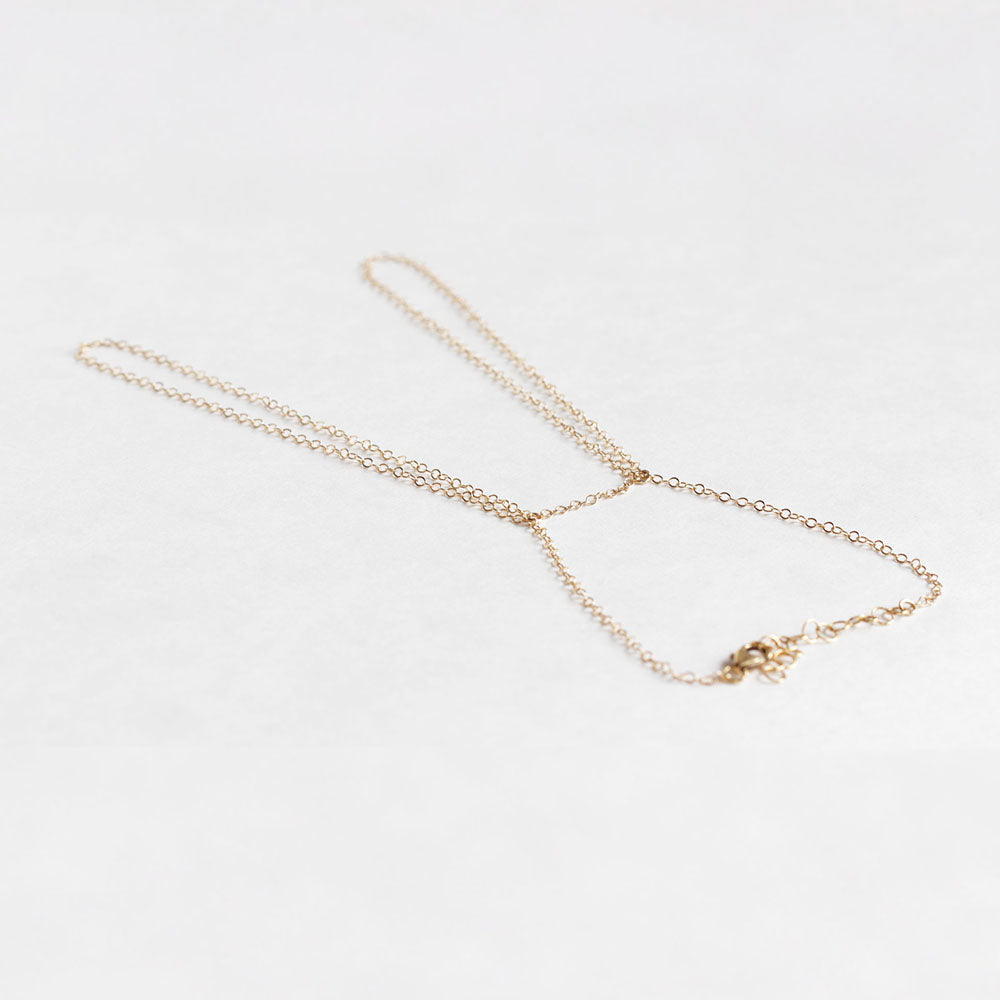 Delicate gold handchain available in gold fill and sterling silver.  Super simple and easy to wear on the daily.  Chains by Lauren