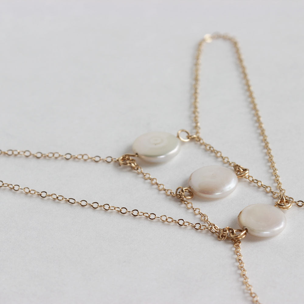 Close up of the Chains by Lauren fresh water pearl hand chain.