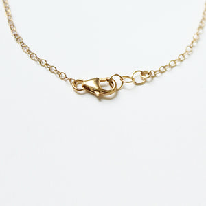 The 3 ring gold necklace is adjustable with a lobster claw and extension.  Handmade.  Chains by Lauren