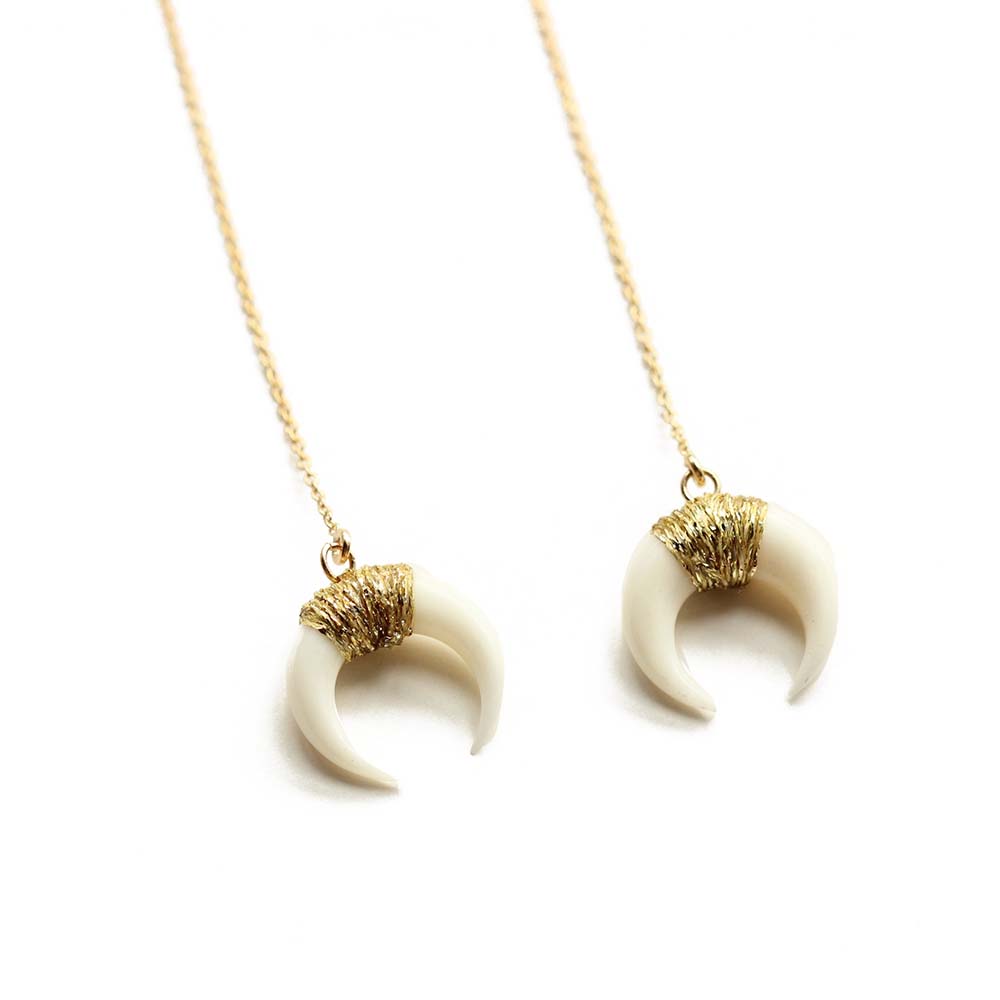 Close up of the horn threader earrings made of gold fill and bone. Perfect for sensitive skin. Handmade. Chains by Lauren.