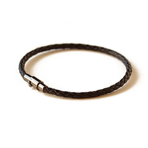 Thin black leather bracelet.  Secures with a magnetic closure and safety lock.  Chains by Lauren
