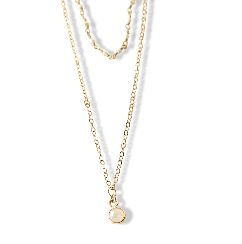 Layering 2 in 1 pearl and gold chain necklace.