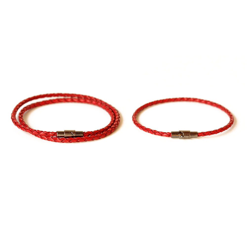 Red leather couple bracelets.  Made from leather and secures with a magnetic closure.  Chains by Lauren