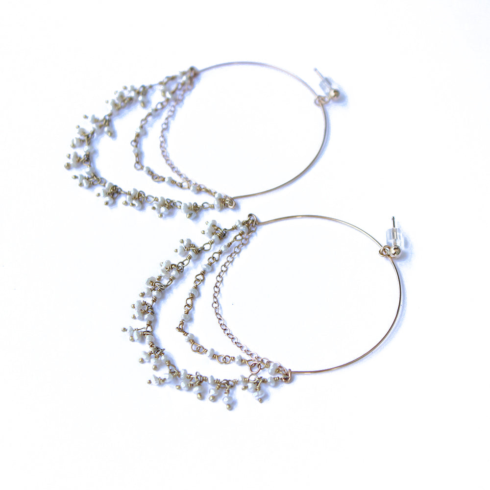 Dangle pearl hoops made with fresh water pearls and gold fill. Handmade. Chains by Lauren  Edit alt text