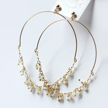 Single strand dangle pearl hoops. Delicate and dainty hoops. Gold fill and great for sensitive skin. Handmade. Chains by Lauren  Edit alt text