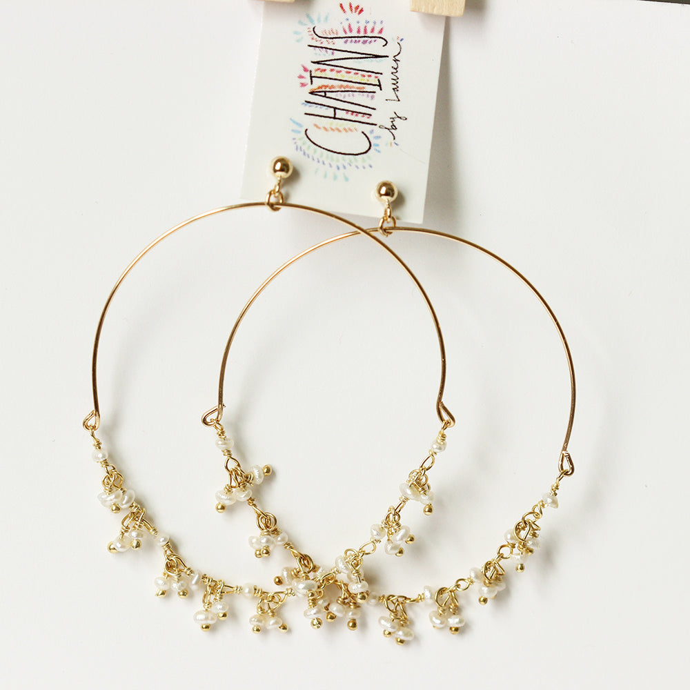 Single strand dangle pearl hoops. Delicate and dainty hoops. Gold fill and great for sensitive skin. Handmade. Chains by Lauren  Edit alt text