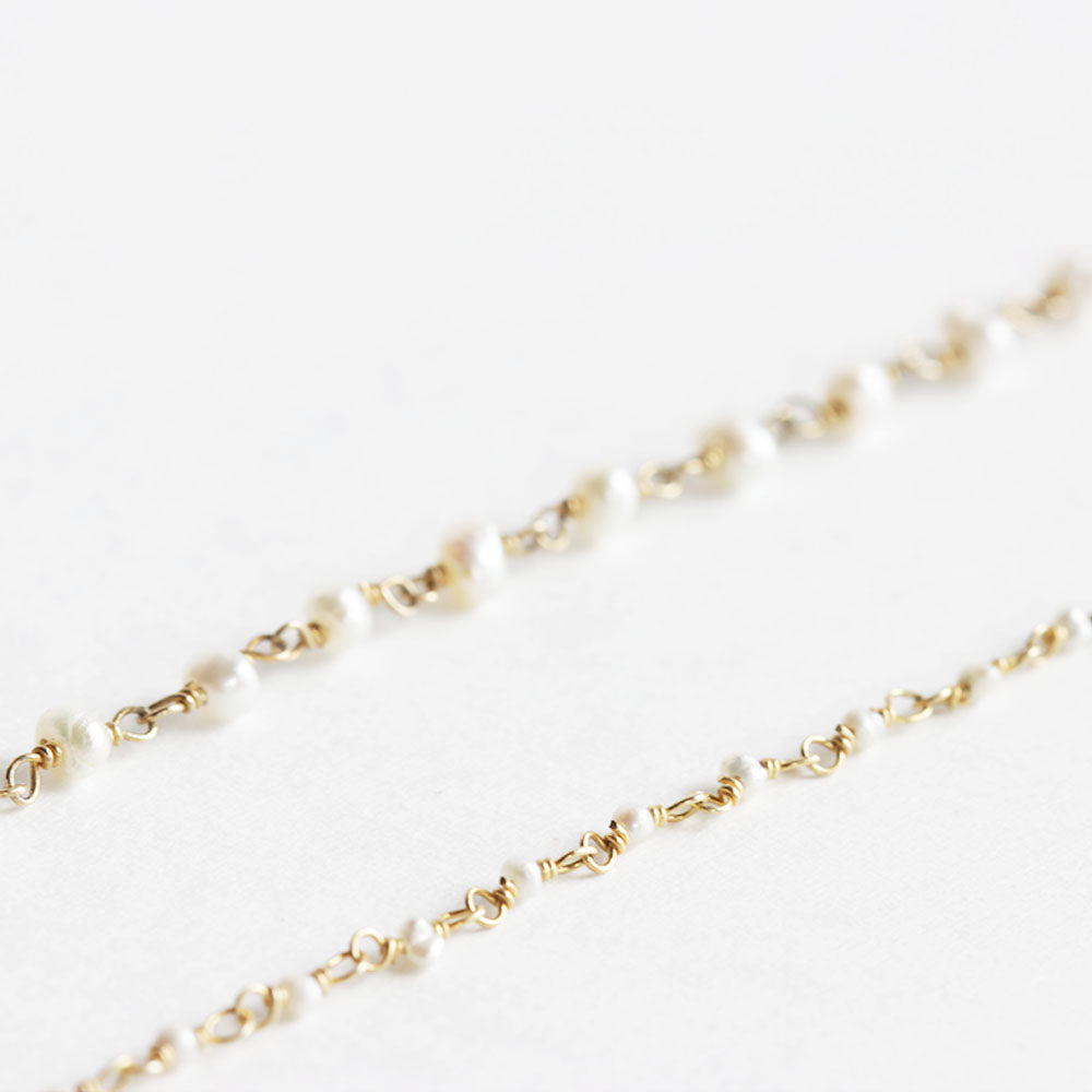Close up of the mother and daughter pearl bracelet set made from fresh water pearl.  The mother wears the larger pearls and the daughter wears the baby pearls.  Choose from a rang of sizes for a 1 to 10 year old.  Handmade with love.  Chains by Lauren