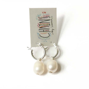 Silver huggie pearl earrings are made with sterling silver and fresh water pearls.  Do you have multiple piercings?  If so, stack the huggies and wear several at a time.  Found on chainsbylauren.us.  Handmade.  Chains by Lauren