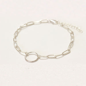This dainty silver paper clip chain charm bracelet is made of sterling silver.  Adjustable so one size fits all.  Add this to your stack!  Chains by Lauren